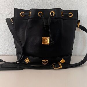 MCM Black Leather Drawstring Bucket Bag with Gold Hardware Accents